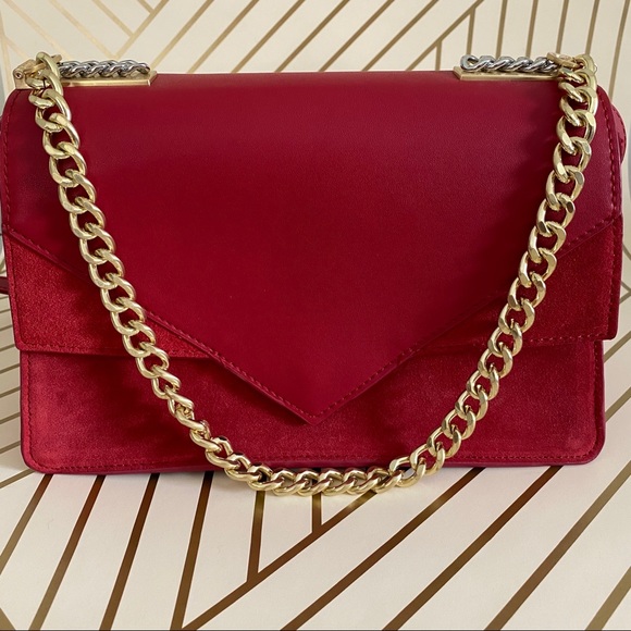 red crossbody bag with gold chain